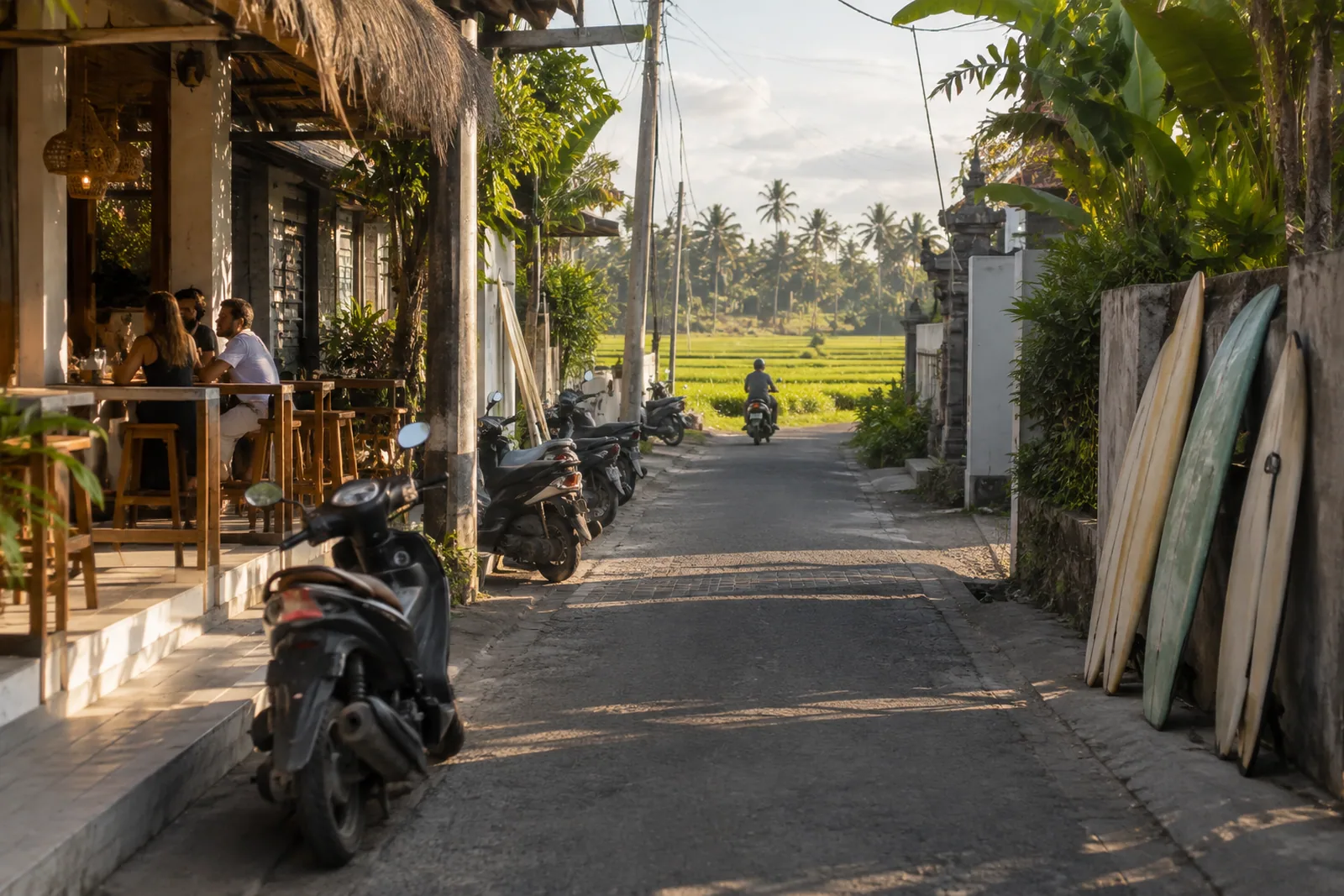 Canggu: cafes, scooters and a rice field at the end of the street.